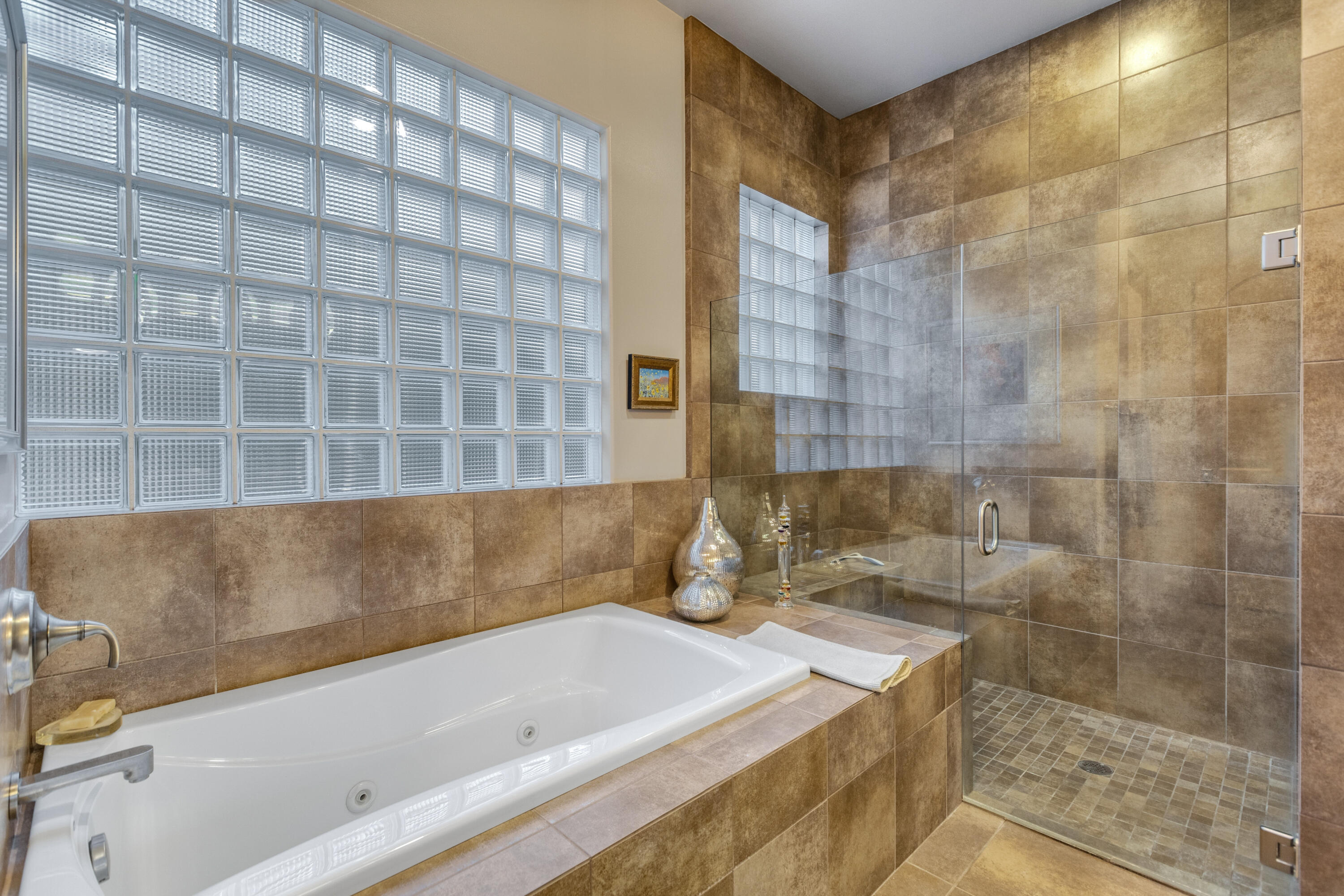 7 Nebulae Way Rancho Mirage, CA 92270 - Photo 26 of 40 a bathroom with a bathtub and a shower