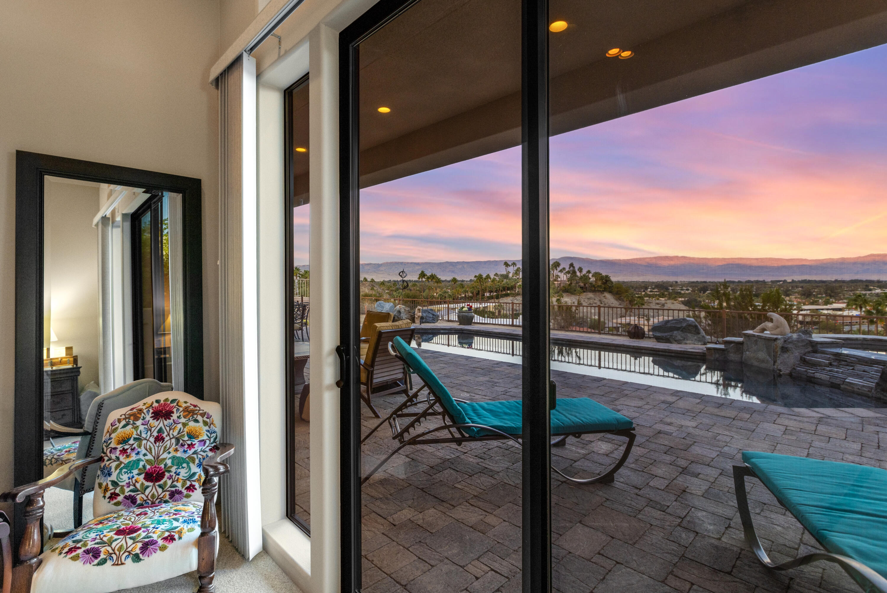 7 Nebulae Way Rancho Mirage, CA 92270 - Photo 27 of 40 a view of a living room and floor to ceiling window