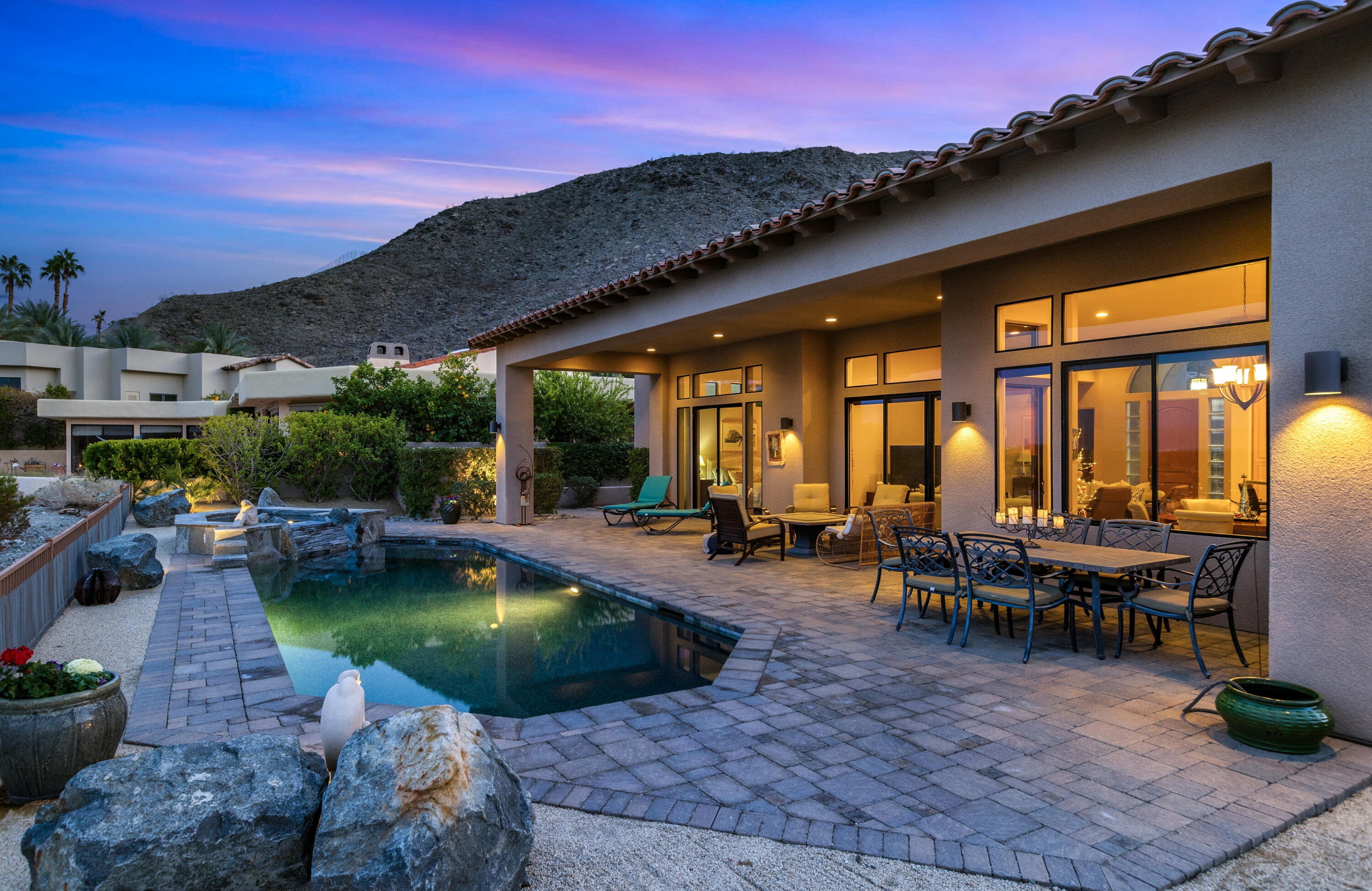 7 Nebulae Way Rancho Mirage, CA 92270 - Photo 33 of 40 a view of a swimming pool with chairs in patio