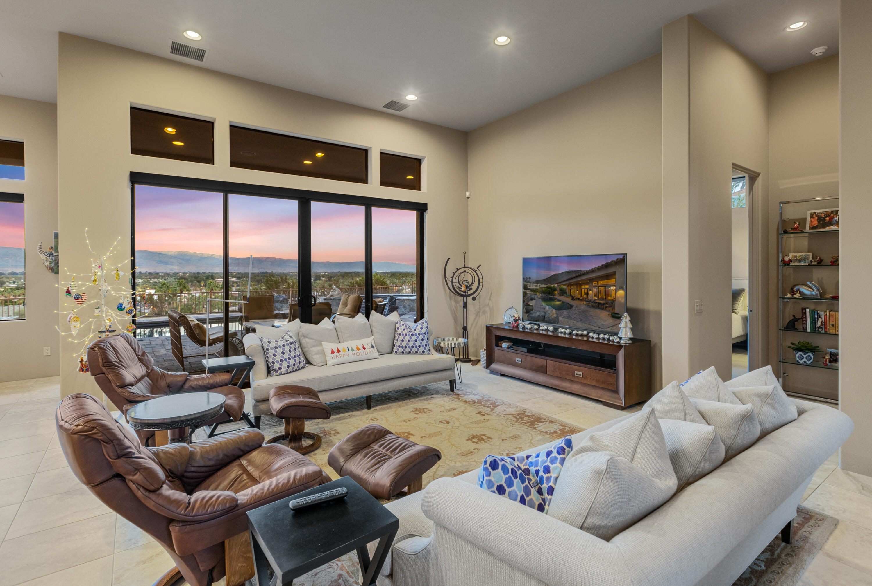 7 Nebulae Way Rancho Mirage, CA 92270 - Photo 10 of 40 a living room with furniture a large window and a flat screen tv