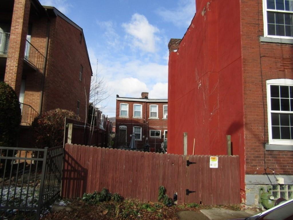 0 Plummer Street Pittsburgh, PA 15201 - Photo 6 of 6 a front view of a house with a yard