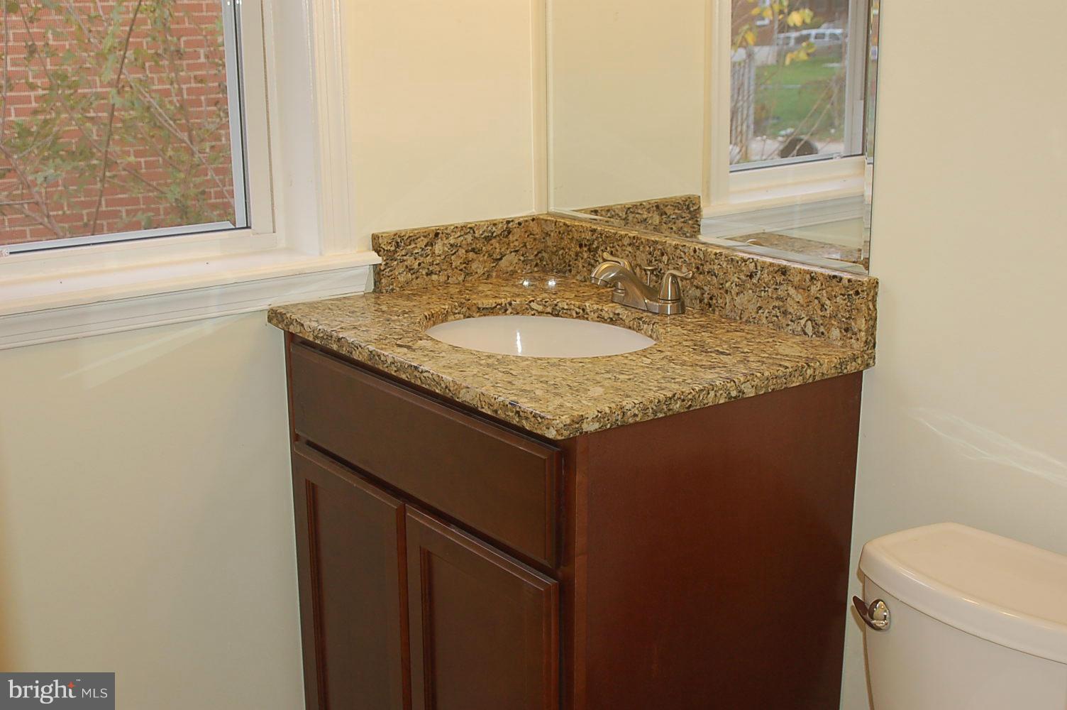 4016 Hilton Road Baltimore, MD 21215 - Photo 21 of 30 Brand new bathroom with granite vanity counter top