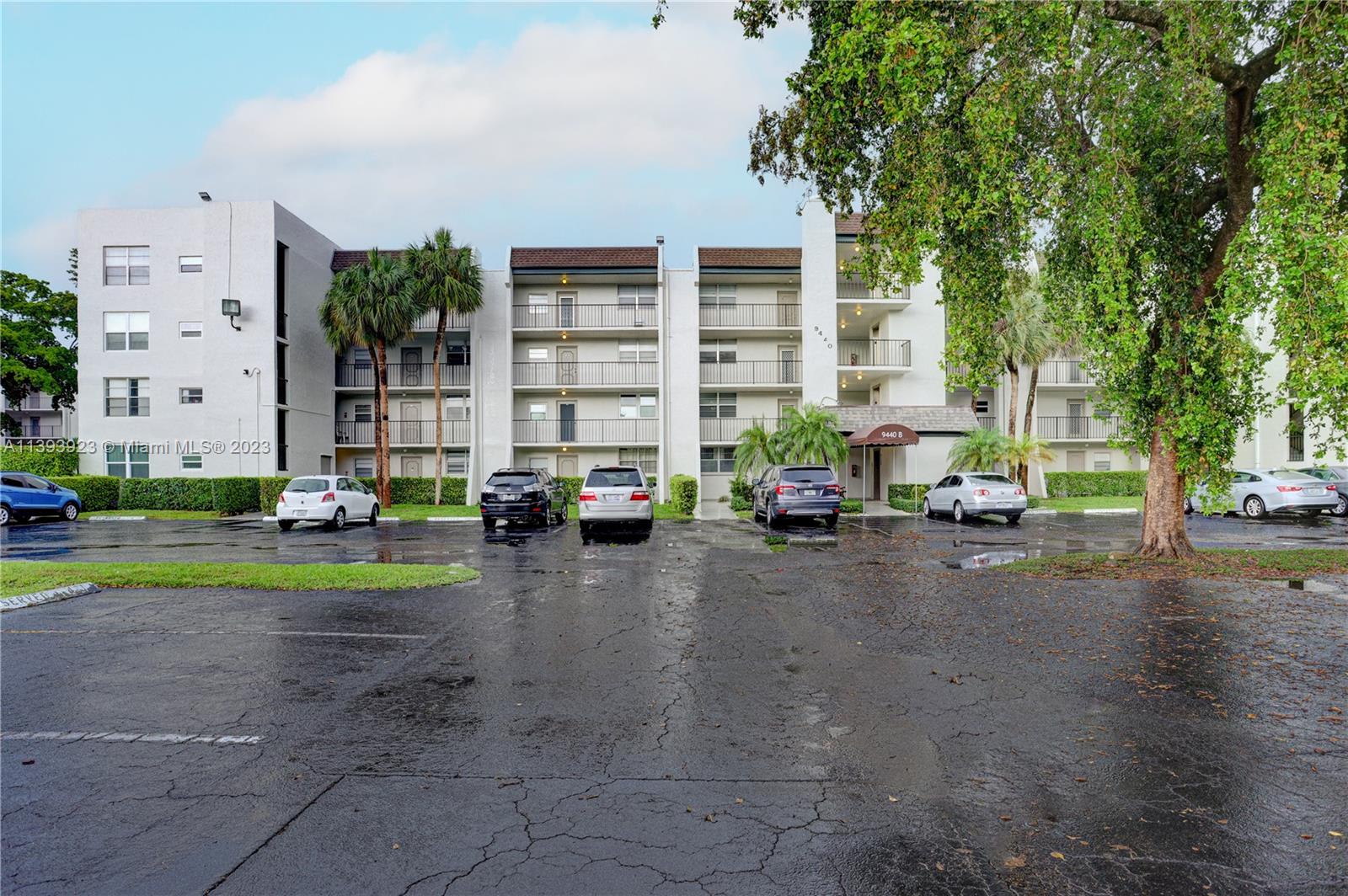 9440 Poinciana Place, Unit 408 Davie, FL 33324 - Photo 1 of 26 a view of a street with cars
