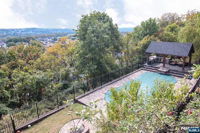 a view of a swimming pool with a patio