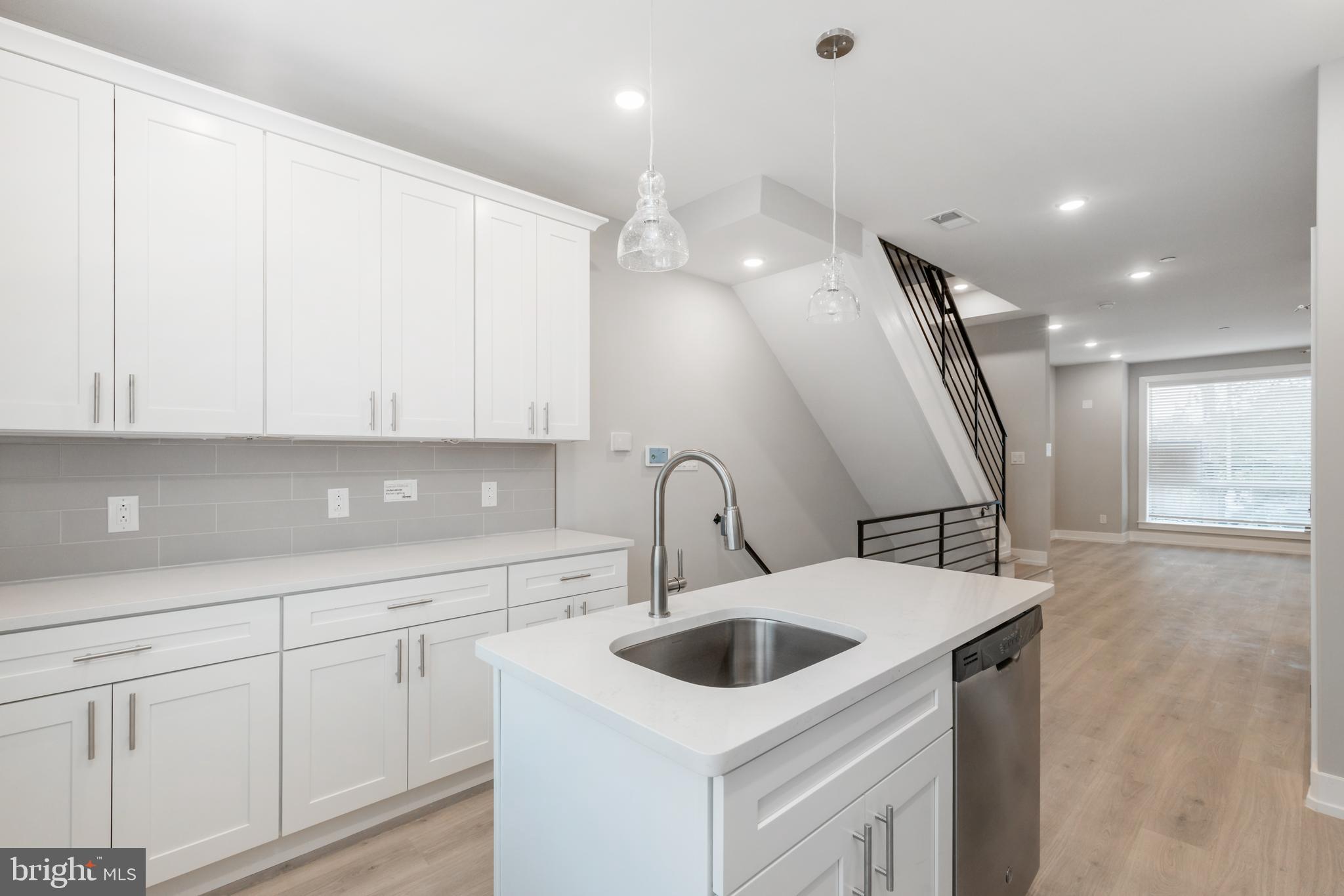2530 North Howard Street, Unit 2 Philadelphia, PA 19133 - Photo 1 of 22 a kitchen with a sink a stove and cabinets