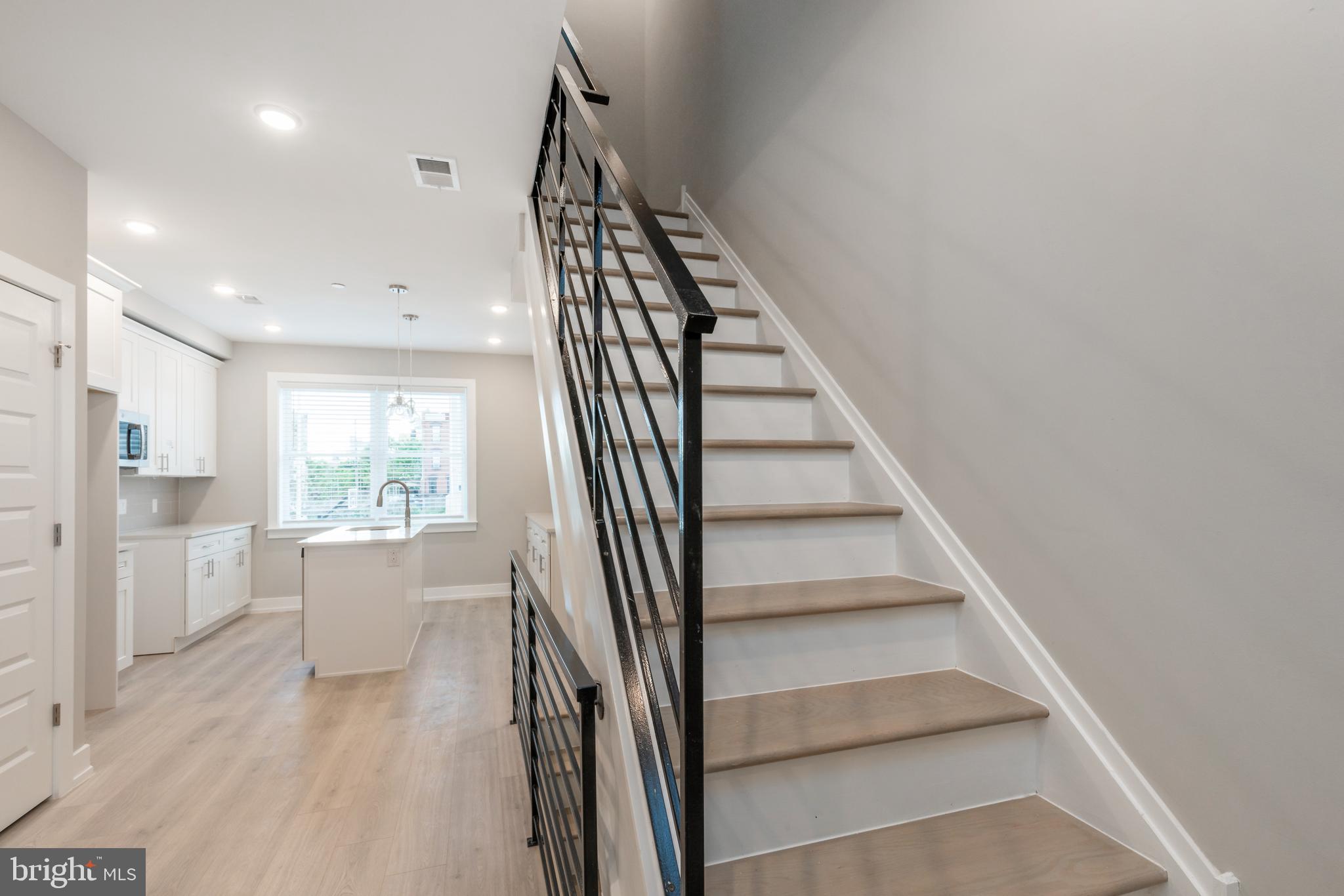 2530 North Howard Street, Unit 2 Philadelphia, PA 19133 - Photo 7 of 22 a view of entryway and kitchen with wooden floor