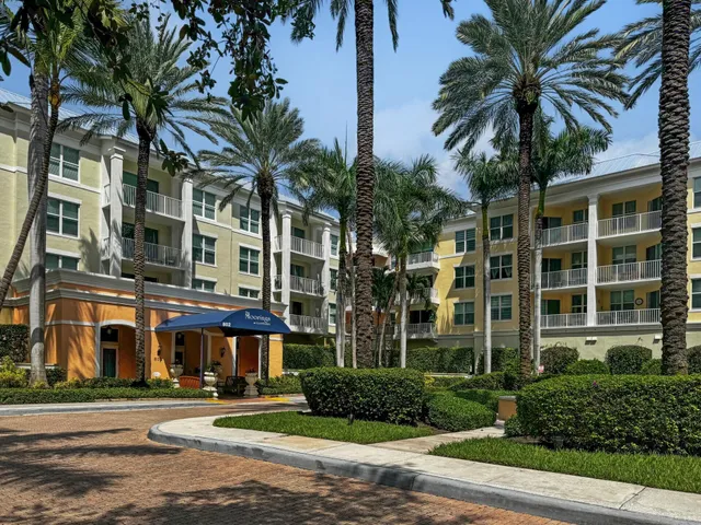 a couple of palm trees in front of building