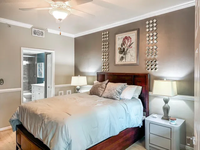 a bathroom with a bathtub shower sink vanity mirror and toilet