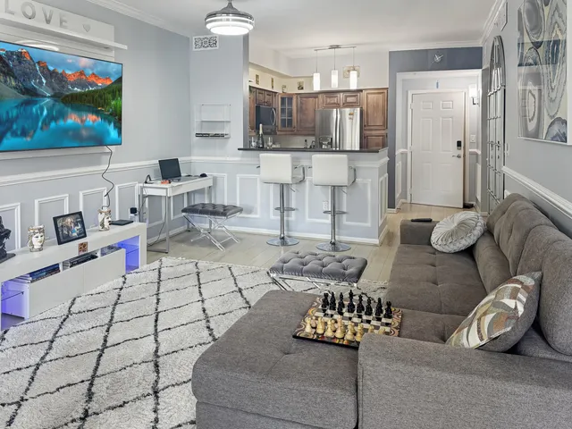 a living room with furniture and a window