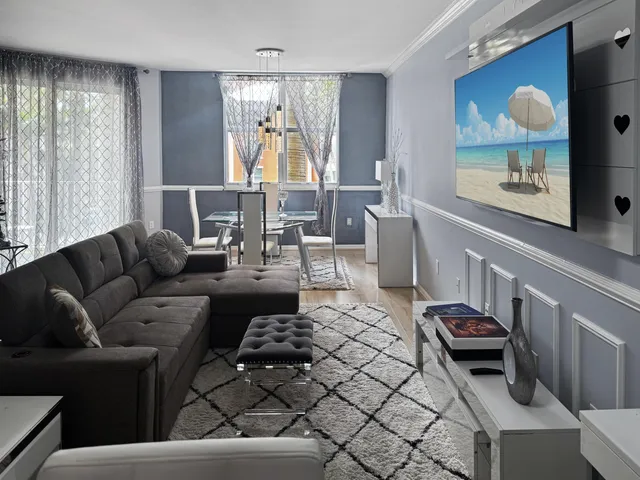 a view of a balcony with a table and chairs