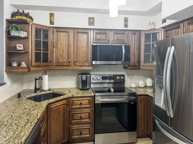 a view of a dining room with furniture and a window