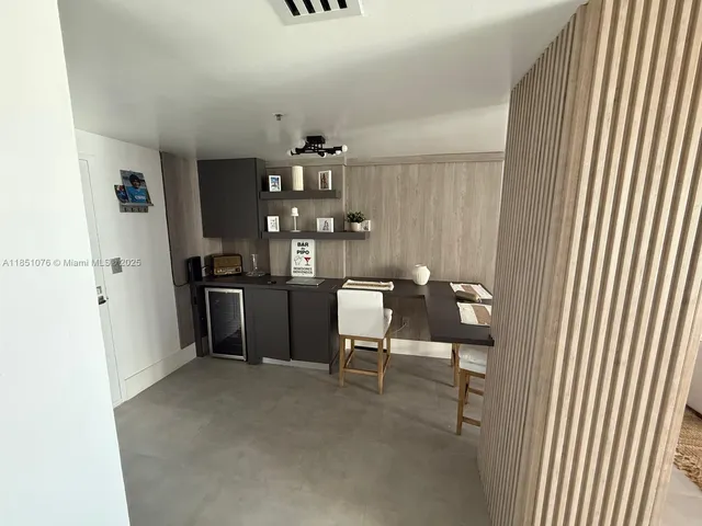 a view of living room with furniture and flat screen tv