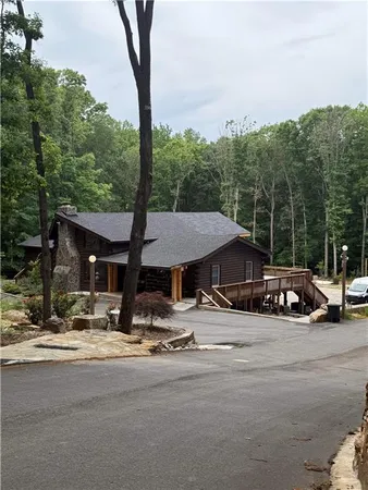 a view of outdoor space with seating area and trees around