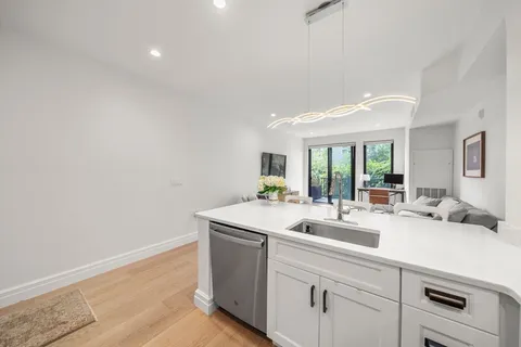 a room with sink washer and dryer