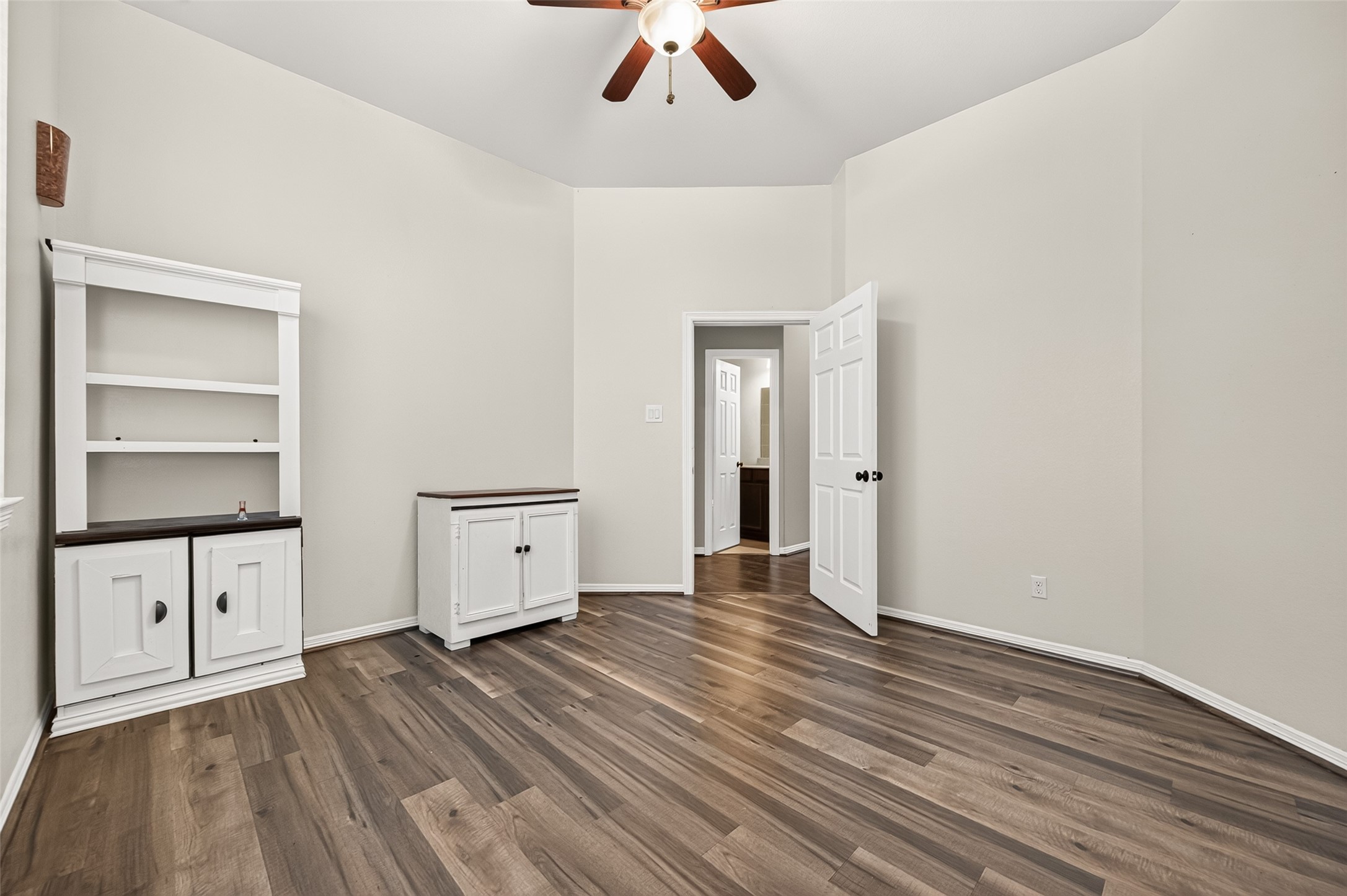 4314 Kent Ranch Court Katy, TX 77494 - Photo 43 of 49 Secondary bedroom with ceiling fan and wood-look flooring.