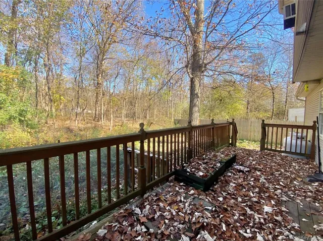 a view of a balcony with wooden fence