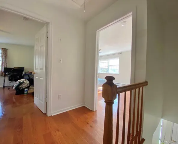 a view of a livingroom with furniture and a window