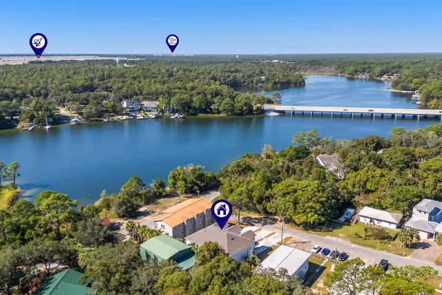 an aerial view of a house with a lake view