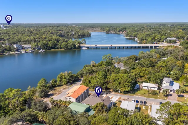 an aerial view of a house with a lake view