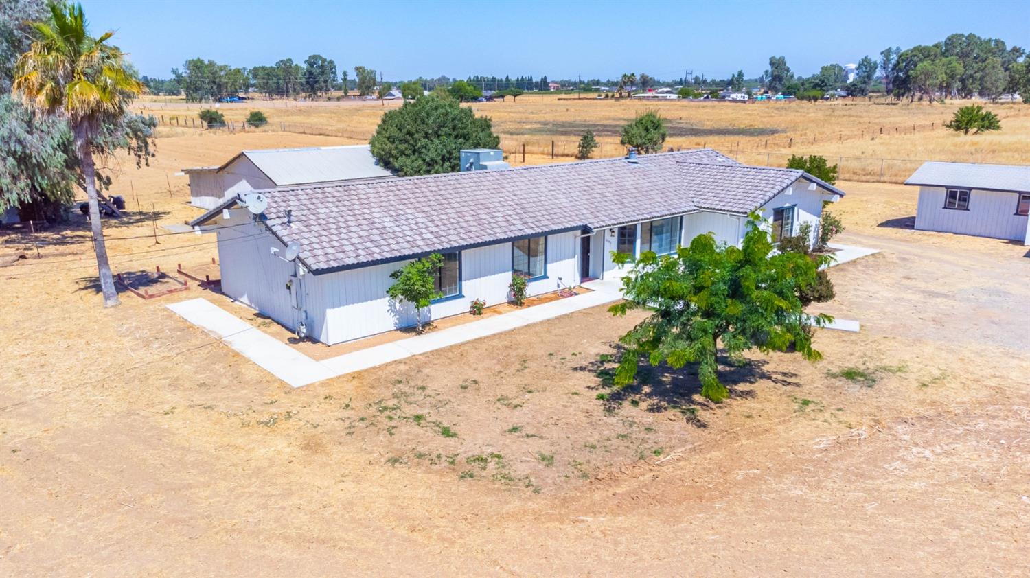 16680 Austin Street Madera, CA 93638 - Photo 21 of 40 an aerial view of house with yard and lake view in back
