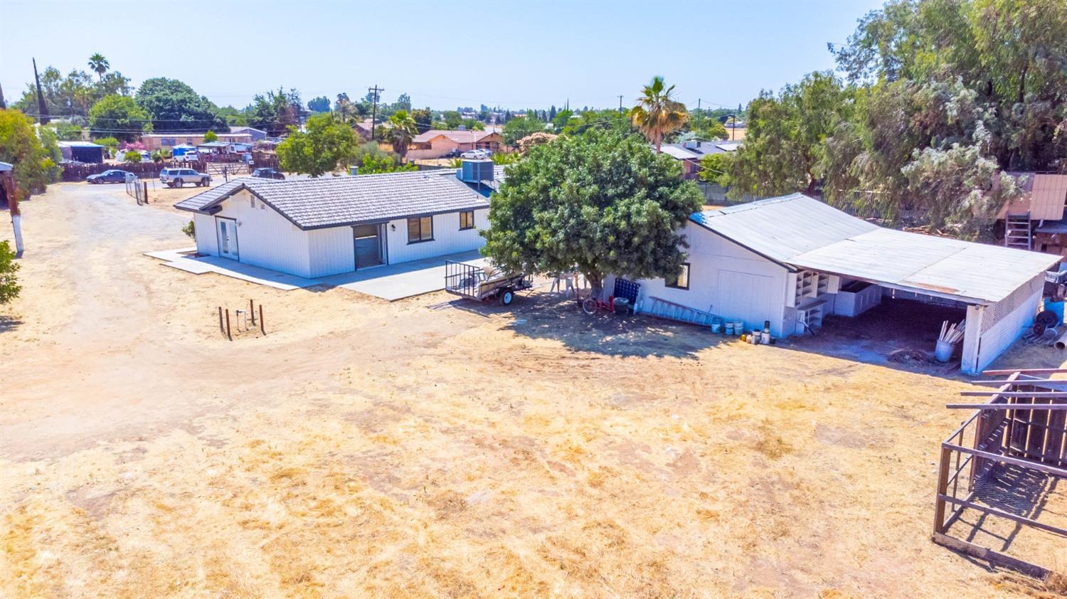 16680 Austin Street Madera, CA 93638 - Photo 23 of 40 a view of a house with a yard and sitting area