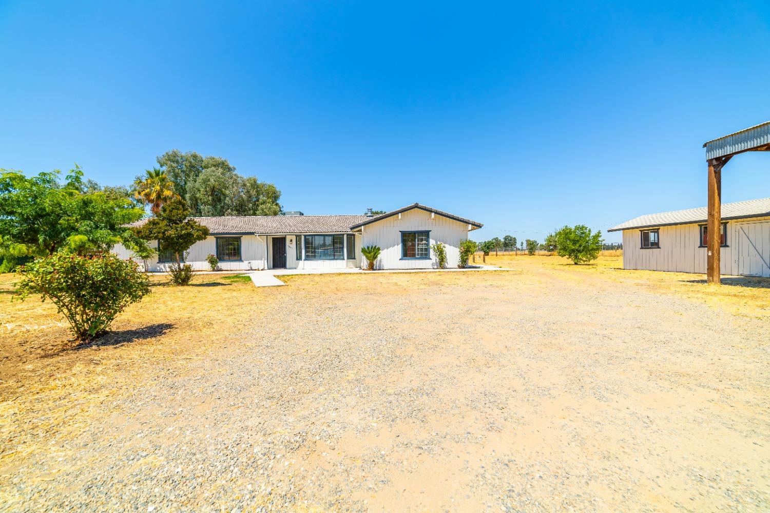 16680 Austin Street Madera, CA 93638 - Photo 27 of 40 a house with swimming pool in front of it