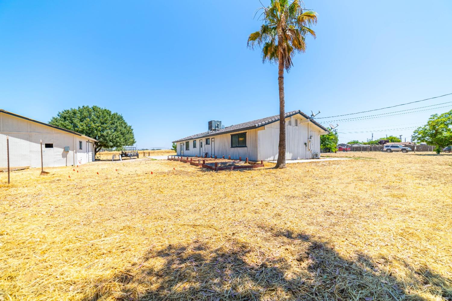 16680 Austin Street Madera, CA 93638 - Photo 29 of 40 a house that has a tree in front of it