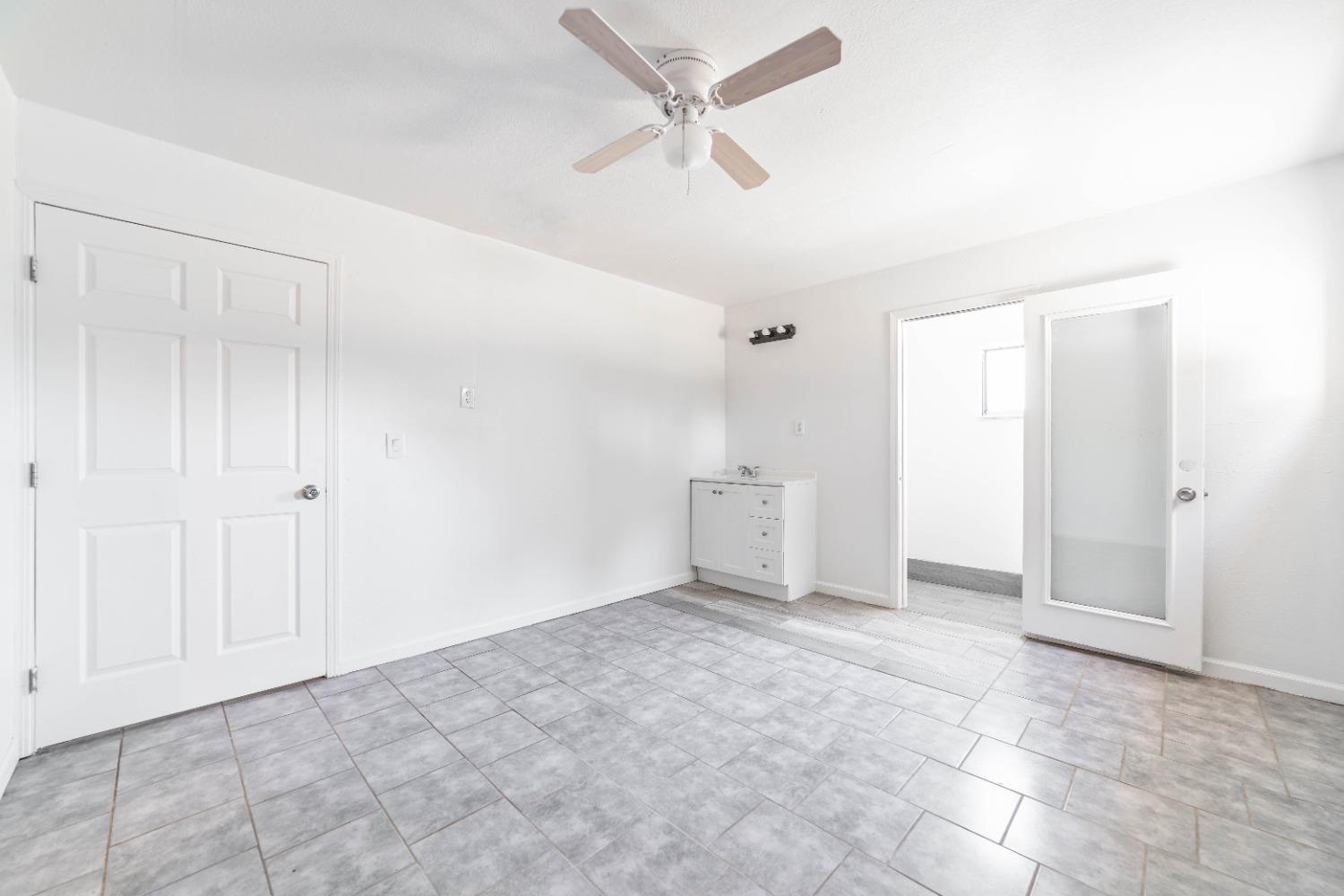 16680 Austin Street Madera, CA 93638 - Photo 36 of 40 an empty room with closet and windows