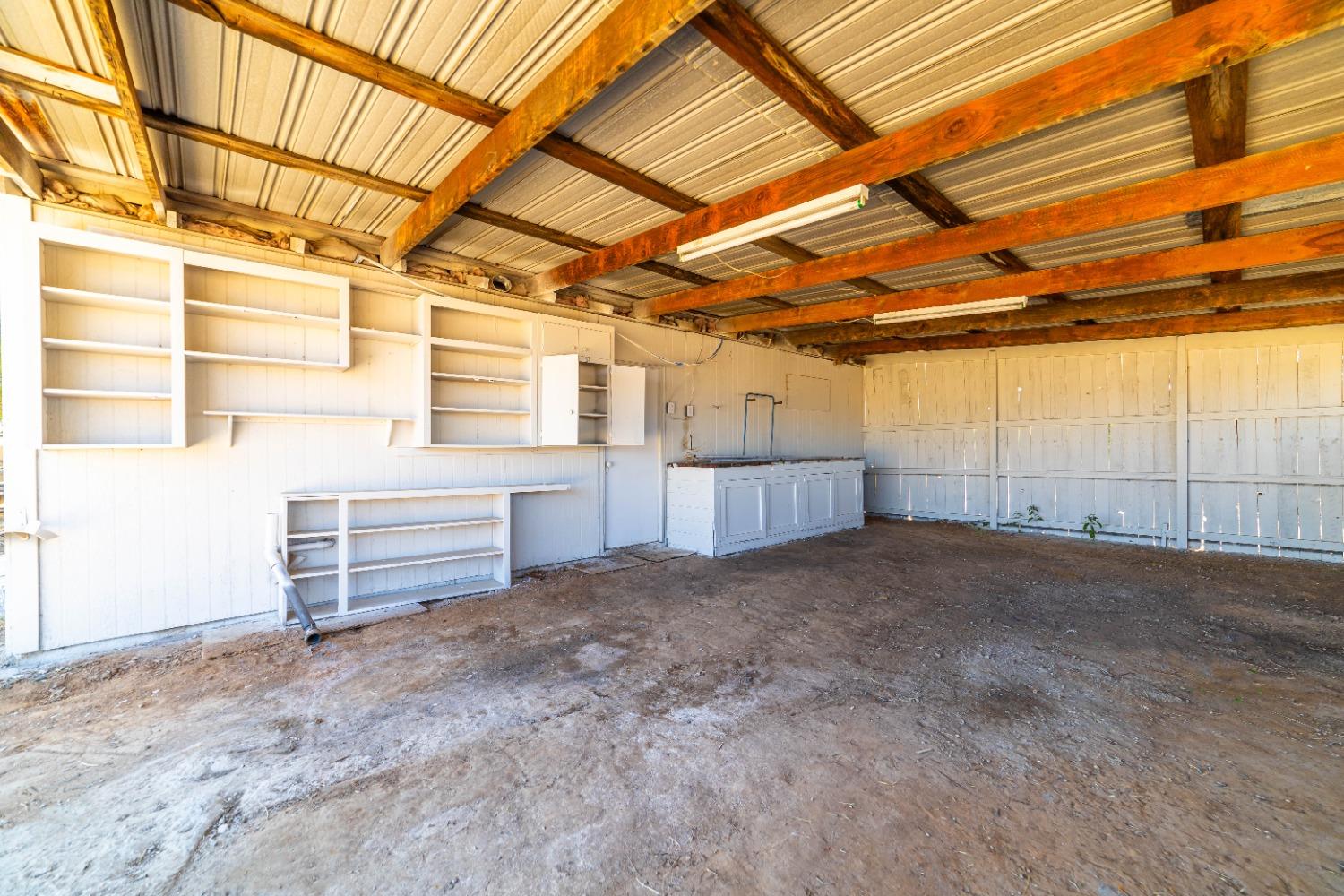 16680 Austin Street Madera, CA 93638 - Photo 40 of 40 a view of a room with racks on the wall