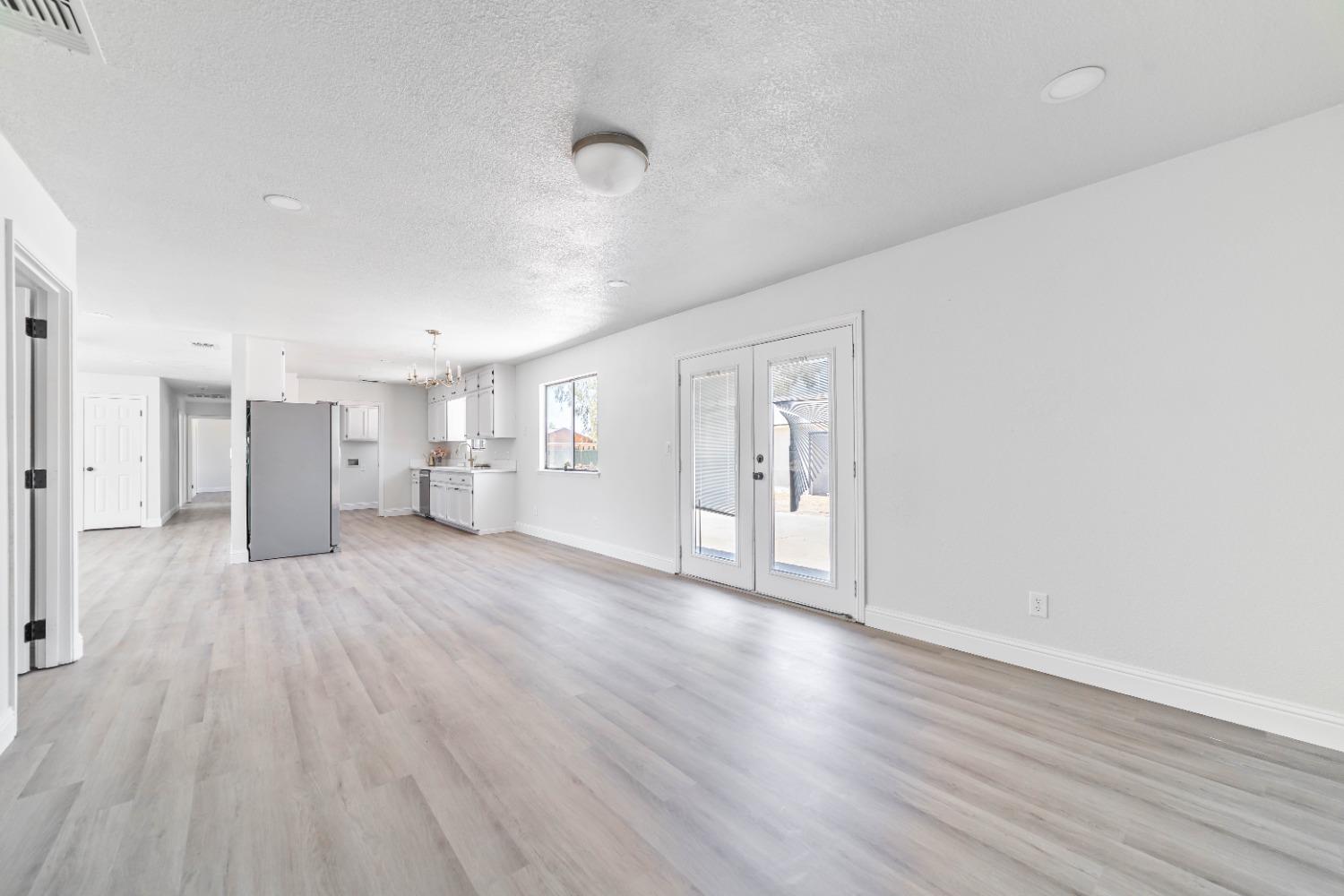 16680 Austin Street Madera, CA 93638 - Photo 7 of 40 a view of empty room with wooden floor