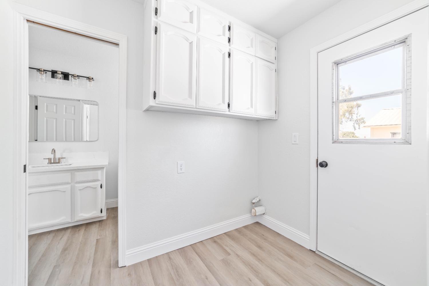 16680 Austin Street Madera, CA 93638 - Photo 10 of 40 a view of an empty room with window and wooden floor
