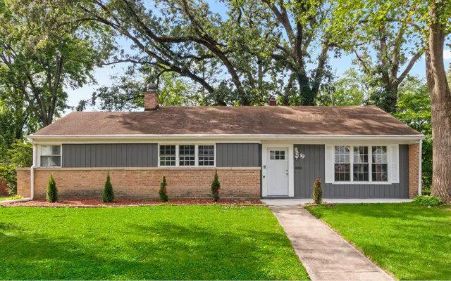 front view of a house with a yard
