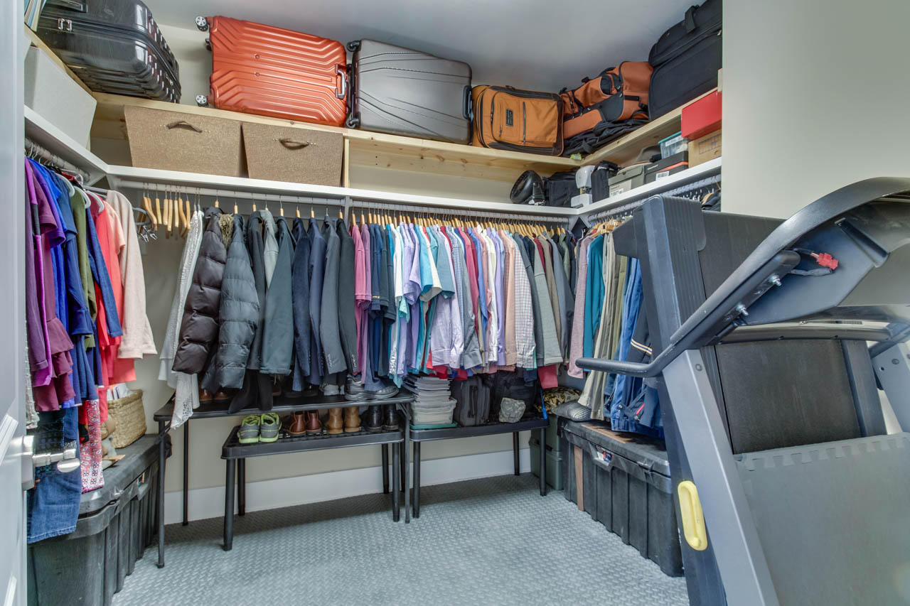 655 Flatwoods Forest Loop Santa Rosa Beach, FL 32459 - Photo 25 of 48 a utility room with lots of clothes and shoes
