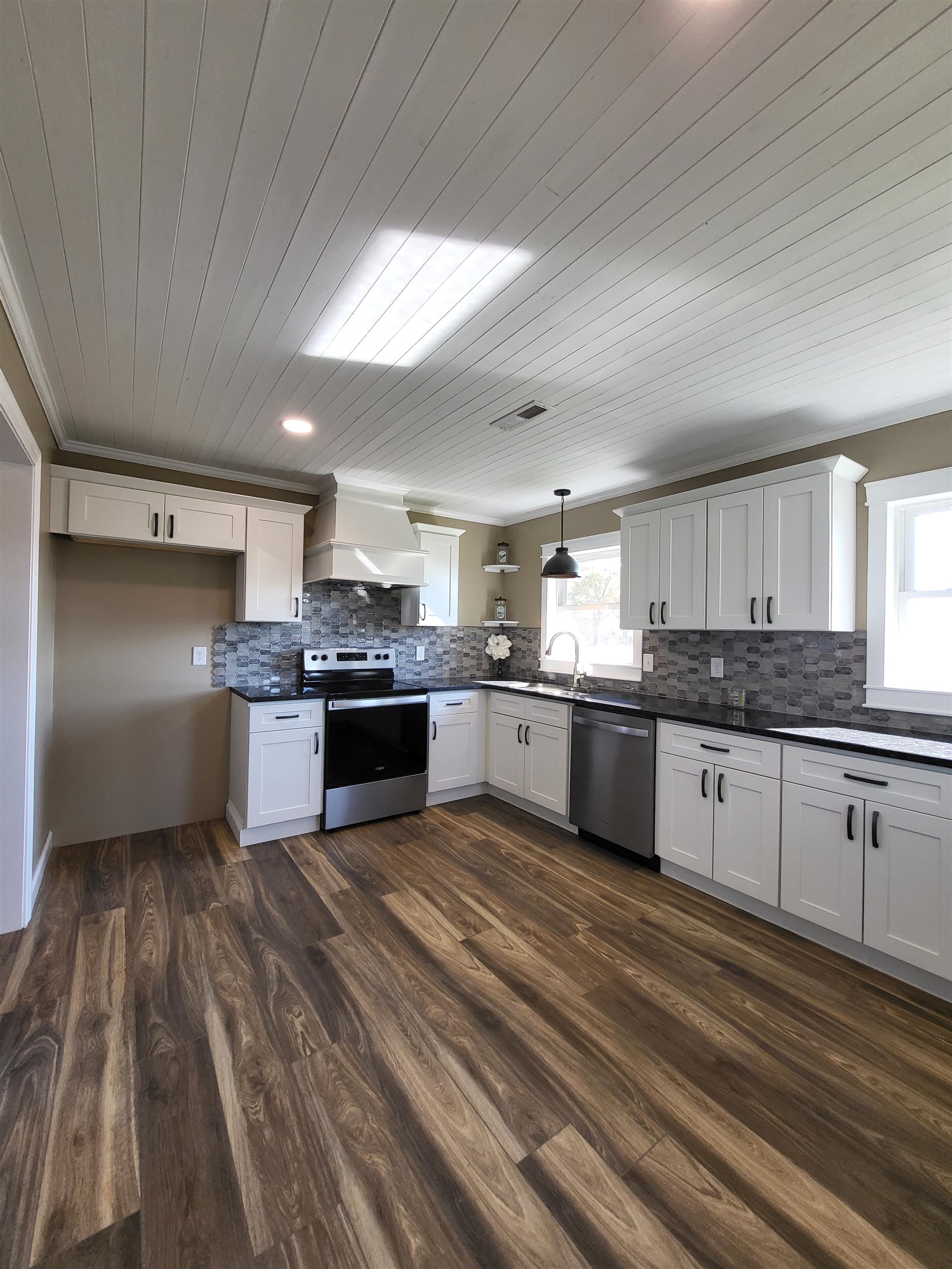 3637 Lightfoot Luckett Road Ripley, TN 38063 - Photo 13 of 25 a large kitchen with kitchen island a sink stainless steel appliances and cabinets