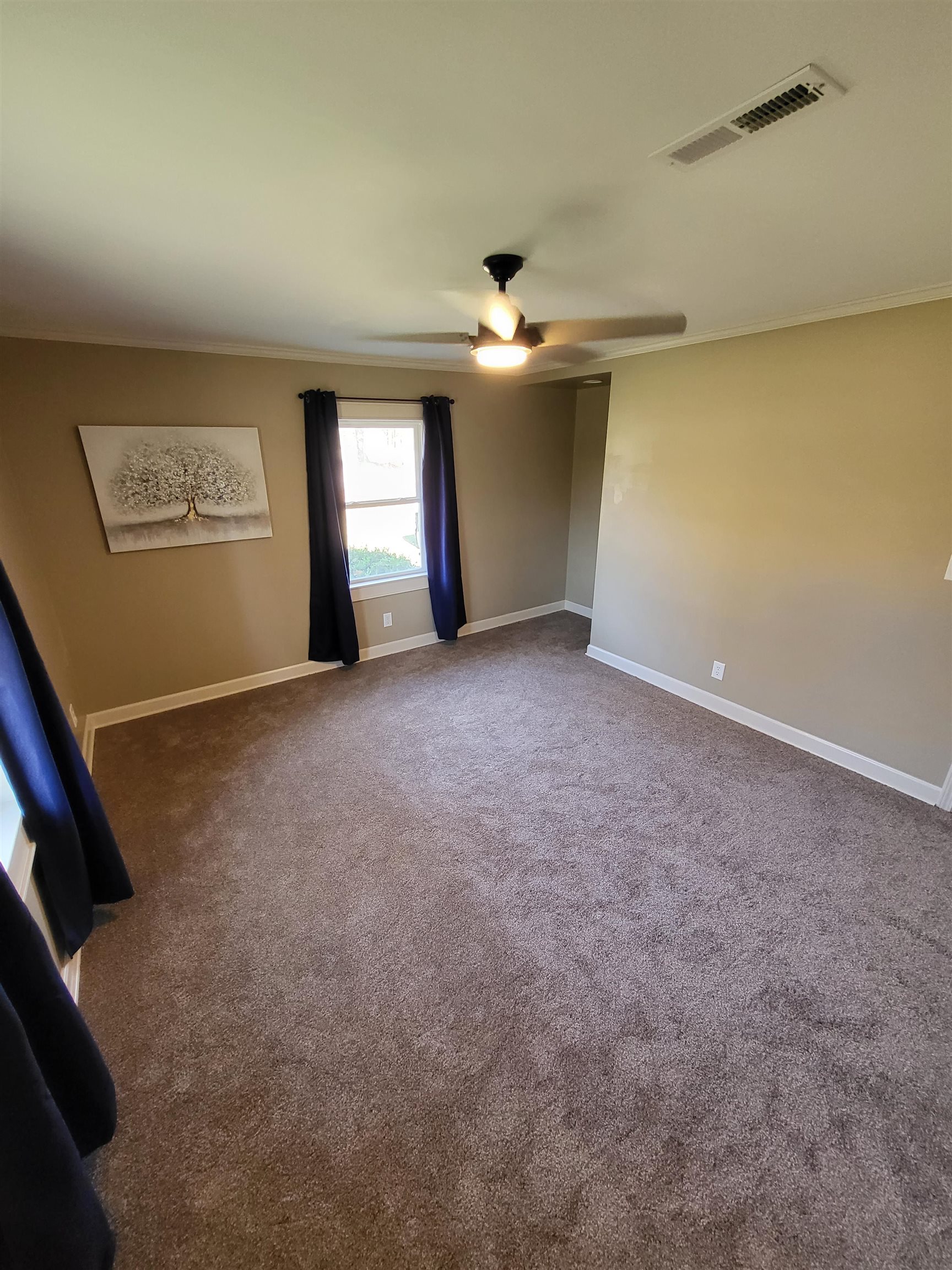 3637 Lightfoot Luckett Road Ripley, TN 38063 - Photo 18 of 25 an empty room with a ceiling fan and window