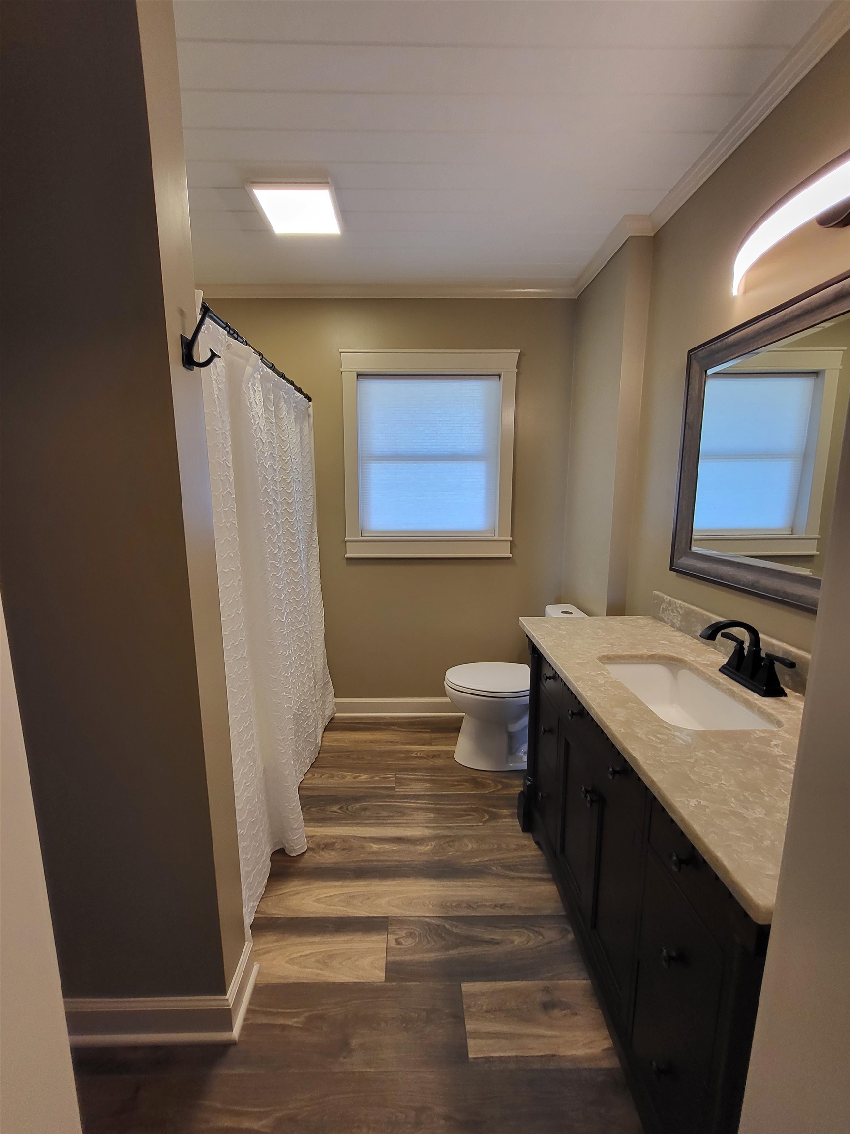 3637 Lightfoot Luckett Road Ripley, TN 38063 - Photo 20 of 25 a bathroom with a sink and a mirror