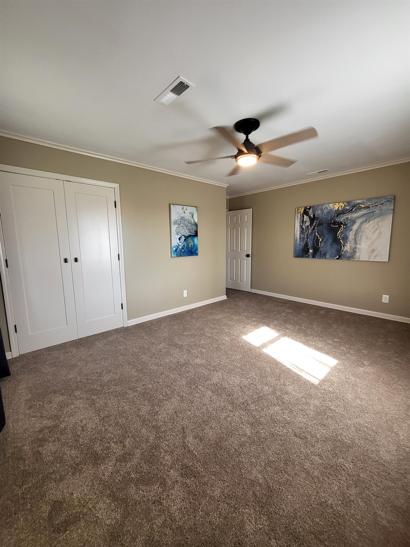 3637 Lightfoot Luckett Road Ripley, TN 38063 - Photo 23 of 25 an empty room with windows and fan