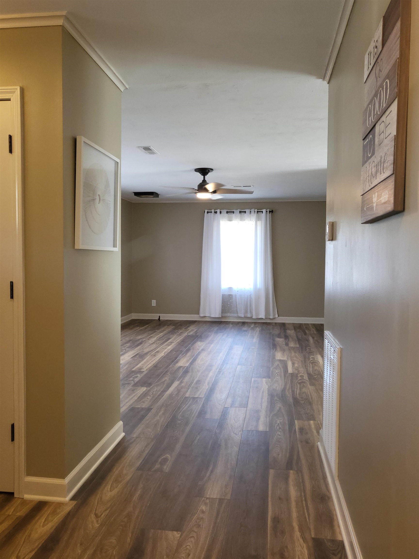 3637 Lightfoot Luckett Road Ripley, TN 38063 - Photo 7 of 25 a view of empty room with wooden floor and fan
