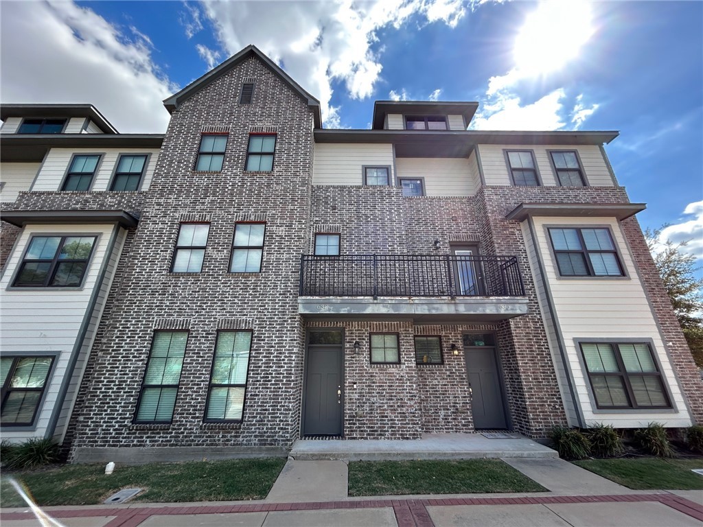 632 Clay Street, Unit B Bryan, TX 77801 - Photo 1 of 16 a front view of a house with a yard