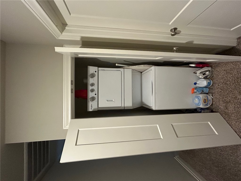 632 Clay Street, Unit B Bryan, TX 77801 - Photo 11 of 16 a utility room with dryer and washer