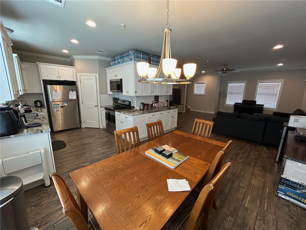 632 Clay Street, Unit B Bryan, TX 77801 - Photo 4 of 16 a large kitchen with a table and chairs