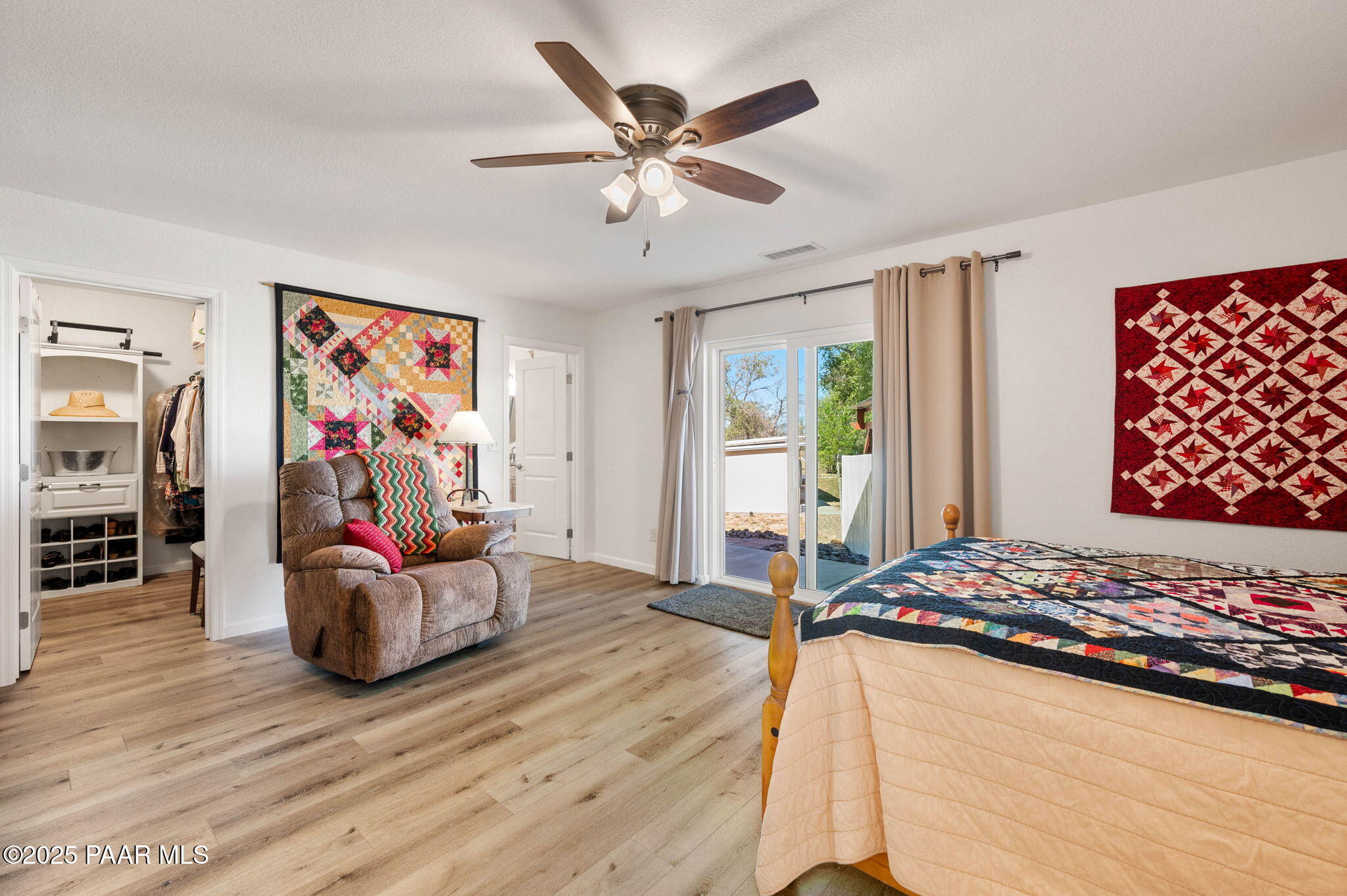 1326 East Ben Road Chino Valley, AZ 86323 - Photo 23 of 51 a bedroom with wooden floor and a large bed