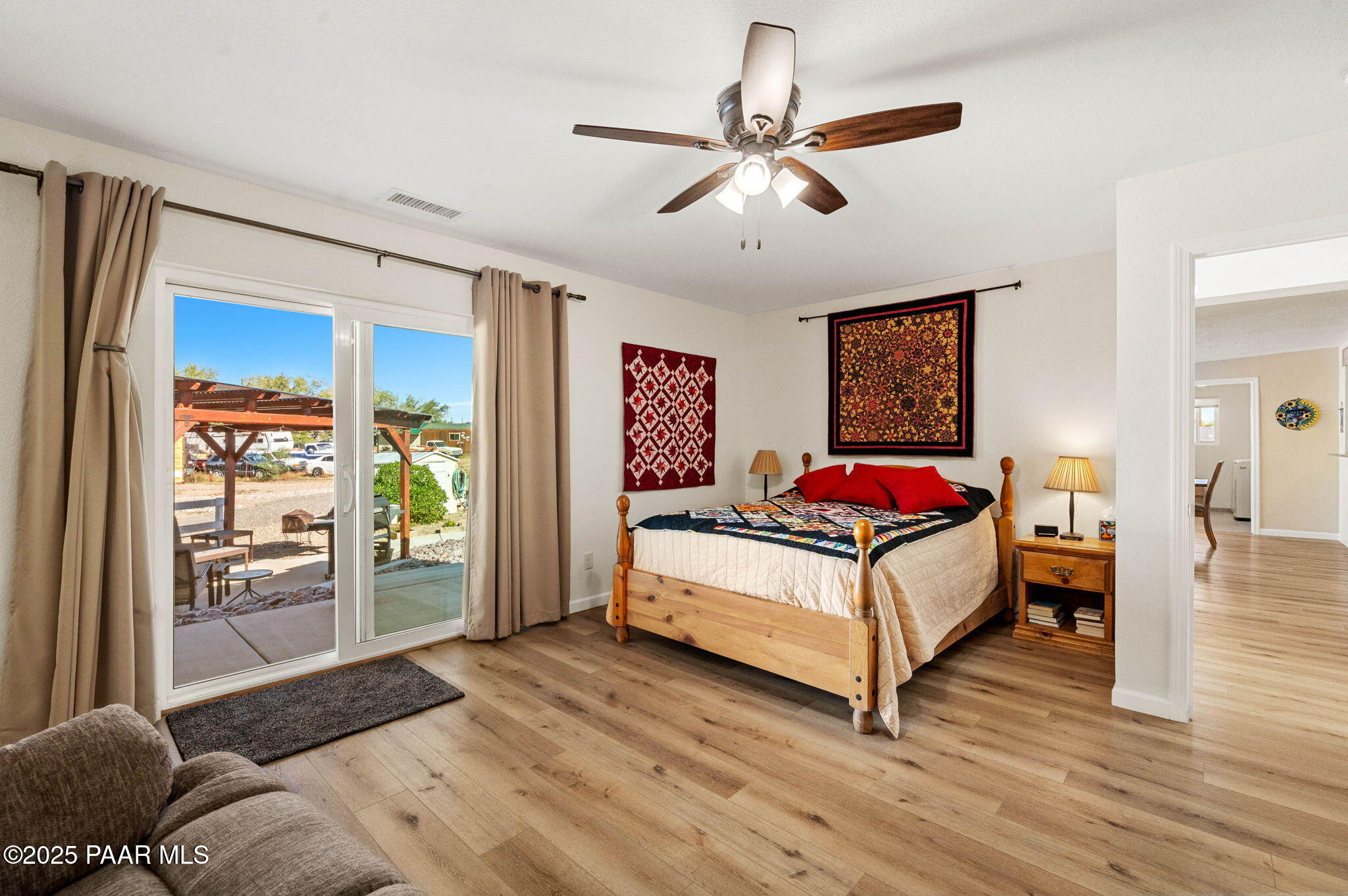 1326 East Ben Road Chino Valley, AZ 86323 - Photo 26 of 51 a bedroom with a bed and wooden floor