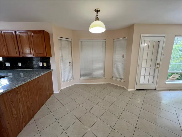 a view of a kitchen with microwave and cabinets