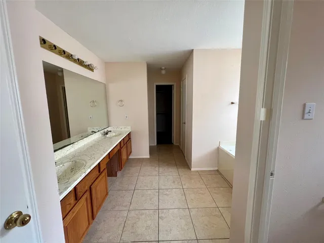 a room with a washing machine and a sink