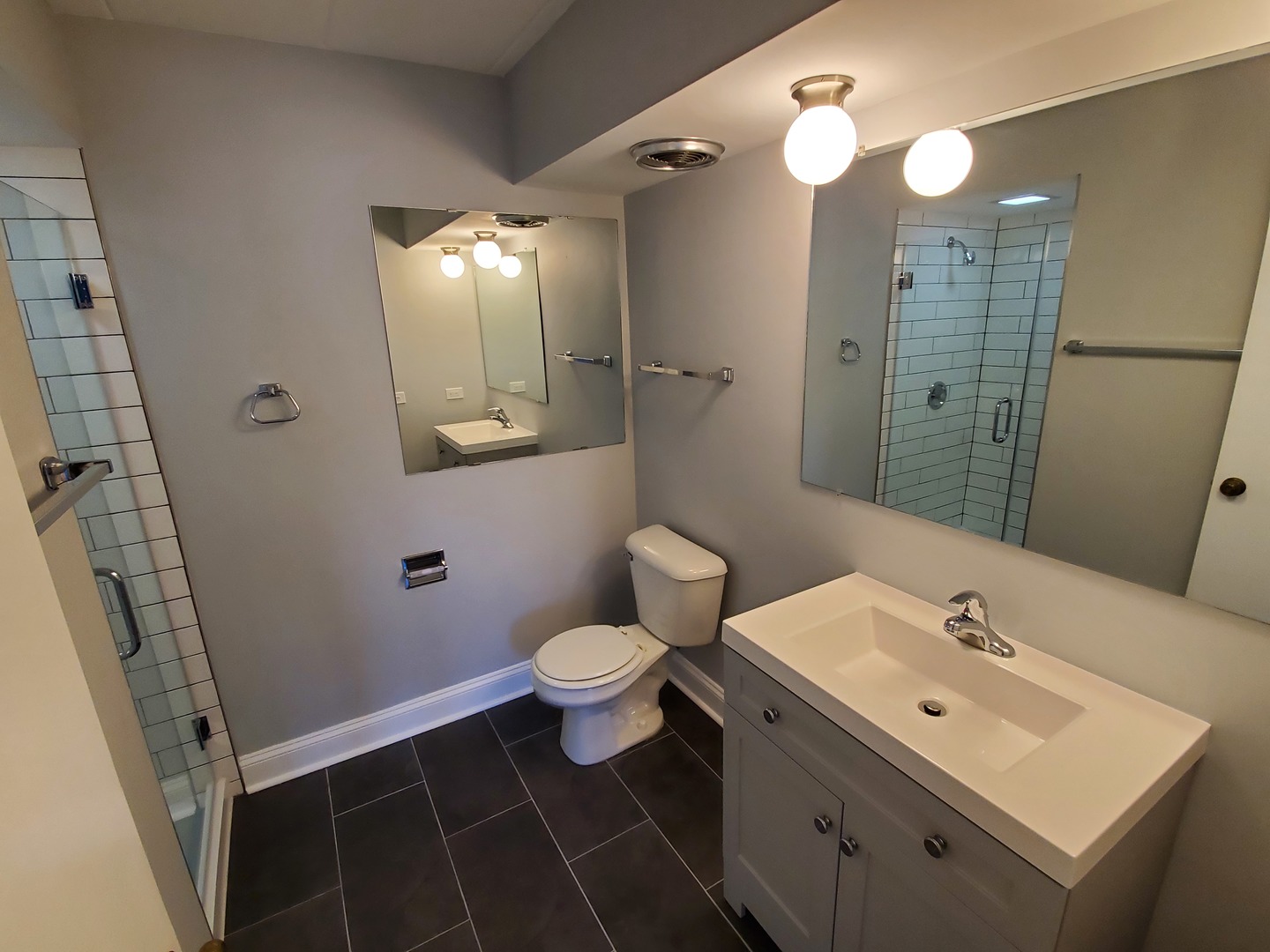 659 South River Road, Unit 5C Des Plaines, IL 60016 - Photo 22 of 24 a bathroom with a sink toilet and shower
