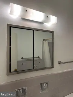 a bathroom with a toilet a sink and bathtub