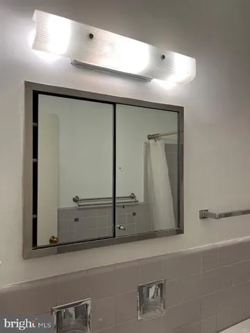 a bathroom with a toilet a sink and bathtub