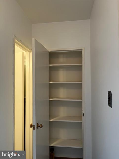 2475 Virginia Avenue Northwest, Unit 908 Washington, DC 20037 - Photo 22 of 24 Spacious linen closet with ample shelving.