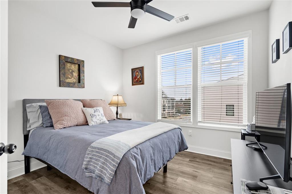 6176 Eves Way Norcross, GA 30071 - Photo 15 of 36 a bedroom with a bed and a table